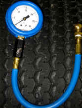 Tire pressure gauge with bleed valve